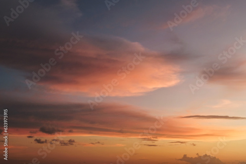  Cotton stratocumulus clouds with the glare of sunset background. Beautiful landscape, it is suitable for background and wallpapper. 