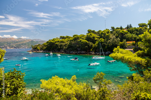 Fototapeta Naklejka Na Ścianę i Meble -  A beautiful bay at the Dalmatian Coastal line close to Dubrovnik with crystal clear and turquoise waters, creating a feeling of paradise

