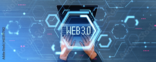 Top view of man using laptop, web 3.0 hologram hud with data blocks