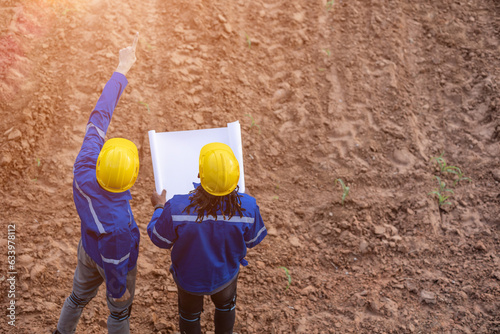 Canvas Print engineer land surveryor teamwork looking inspecting mark contruction site for bu