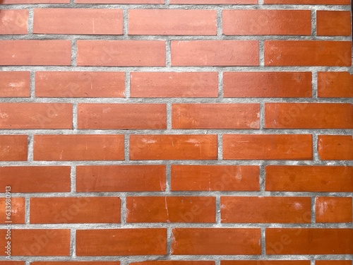 Red brick wall in natural light.