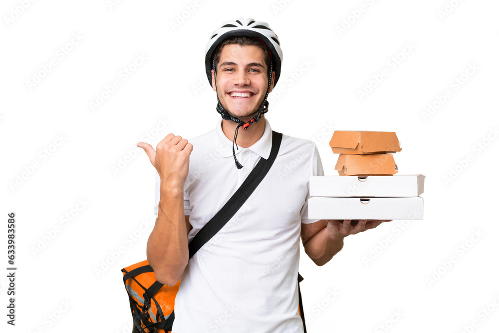 Young caucasian man with thermal backpack over isolated background pointing to the side to present a product Young caucasian man with thermal backpack over isolated background pointing to the side to present a product