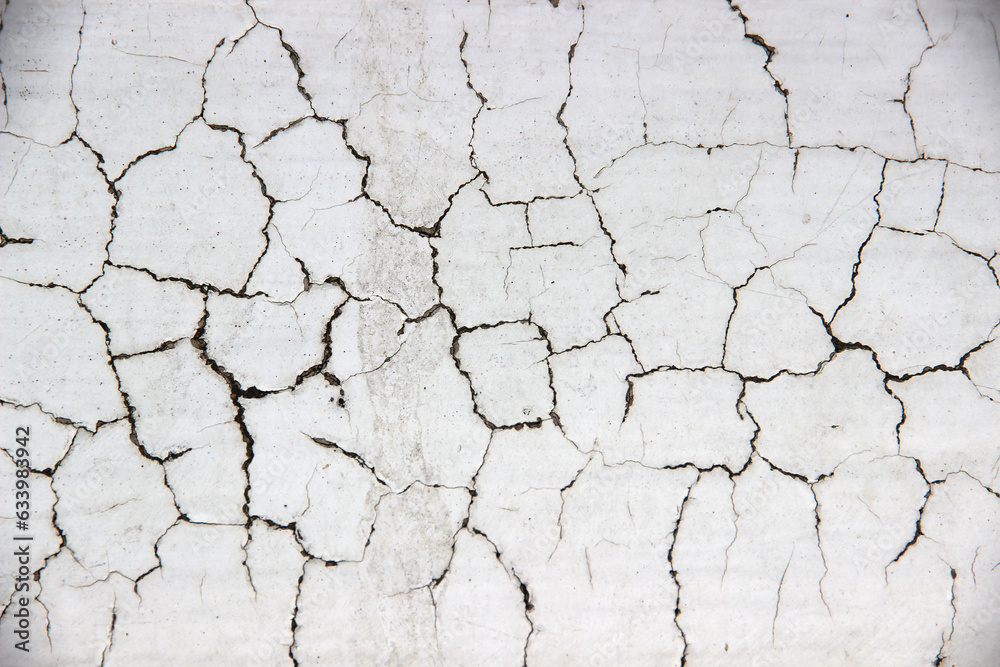 White cement walls, old, dirty and cracked surfaces. White cement walls, old, dirty and cracked surfaces.