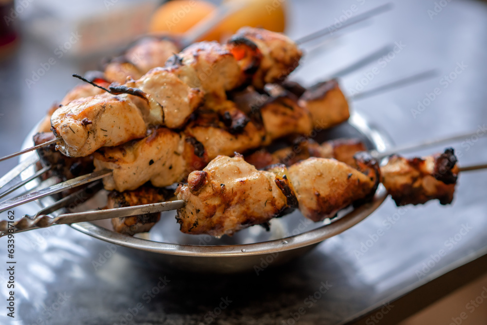 Close up shish kebab on skewers on a plate