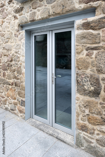 Steel beam lintel on a door of a renovated old house facade. Architecture detail photo