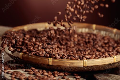 Medium-roasted coffee beans are poured into a basket.