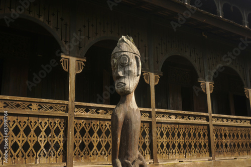 Traditional Dayak (native tribe of Borneo) wood statue that used for religious activity in Pulau Kumala, Tenggarong, Kutai Kartanegara, Indonesia photo