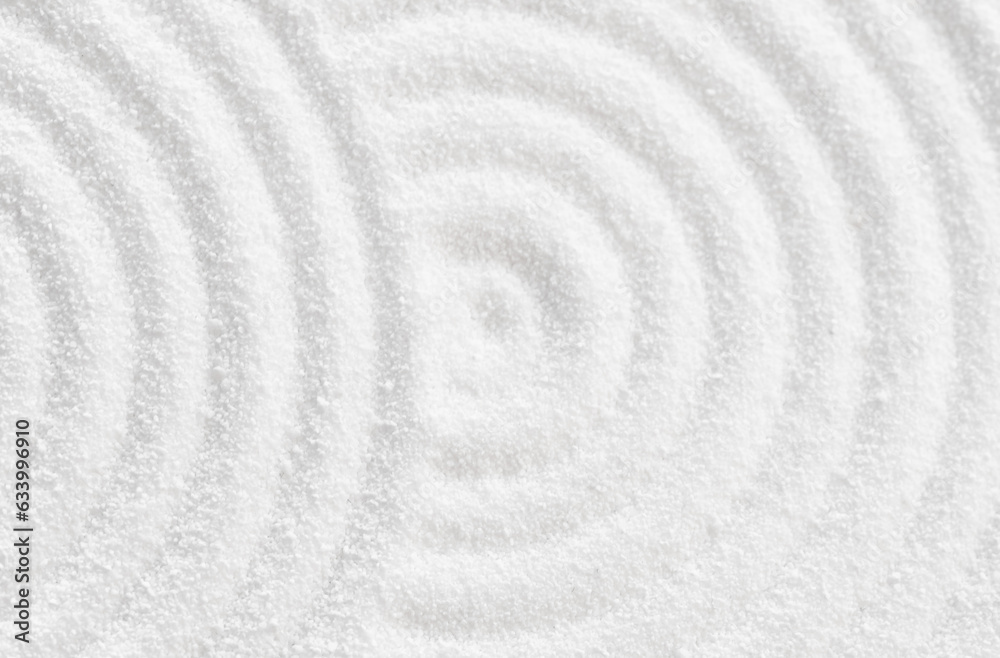 Zen Garden with concentric circless on white sand texture background