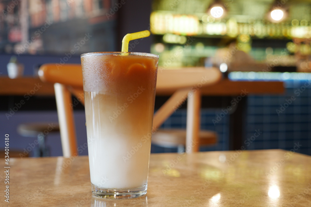 cold coffee in a glass container at cafe 