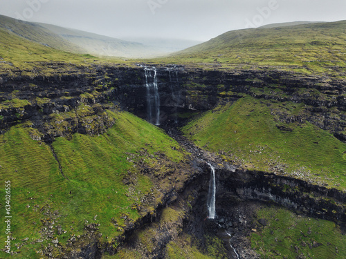 Aerial view of the Fossa Waterfall on island Bordoy. This is the highest waterfall in the Faroe Islands, situated in wild scandinavian scenery.