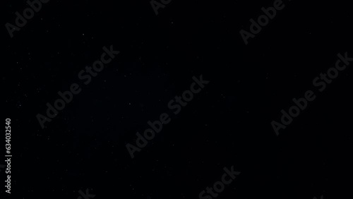 Dust Particles Floating On Black Background	
