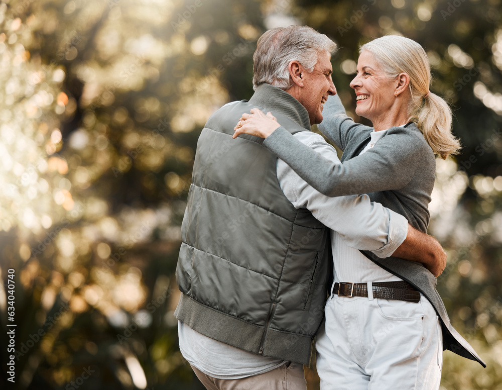 Love, nature and senior happy couple dance, have fun and enjoy quality time together in park, forest or woods. Outdoor wellness, energy and elderly people care, support or bonding during retirement