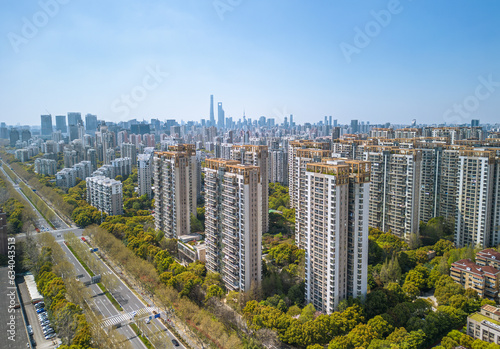 The drone aerial view of residential district in Pudong with skyscrapers in the background, Shanghai, China.