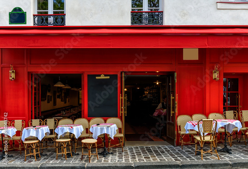 Cozy street with tables of cafe in quarter Montmartre in Paris, France. Architecture and landmark of Paris. Paris cityscape. © Ekaterina Belova