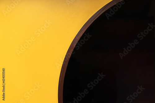 Yellow brick wall with a semicircular doorway