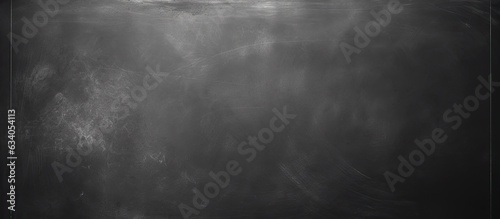 Blackboard or chalkboard texture with white chalk erased on blank wall