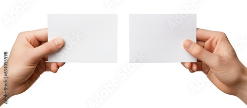 A man s hand holding two empty sheets of paper