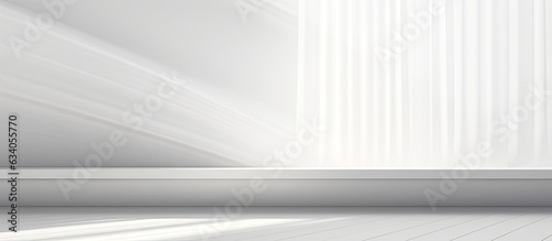 Plain white studio background for showcasing products Vacant space with window shadows Present items against blurred backdrop Gentle focus
