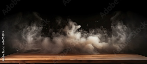 Wooden table with smoke on dark background Ideal for showcasing products