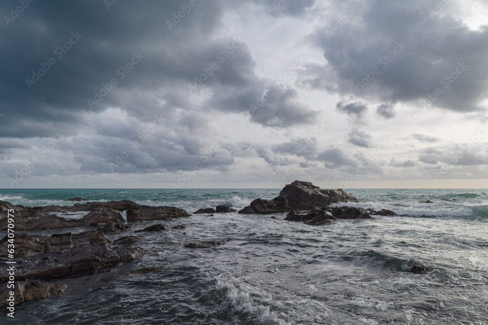 Cumulus clouds hovering over the Ligurian sea, Italy