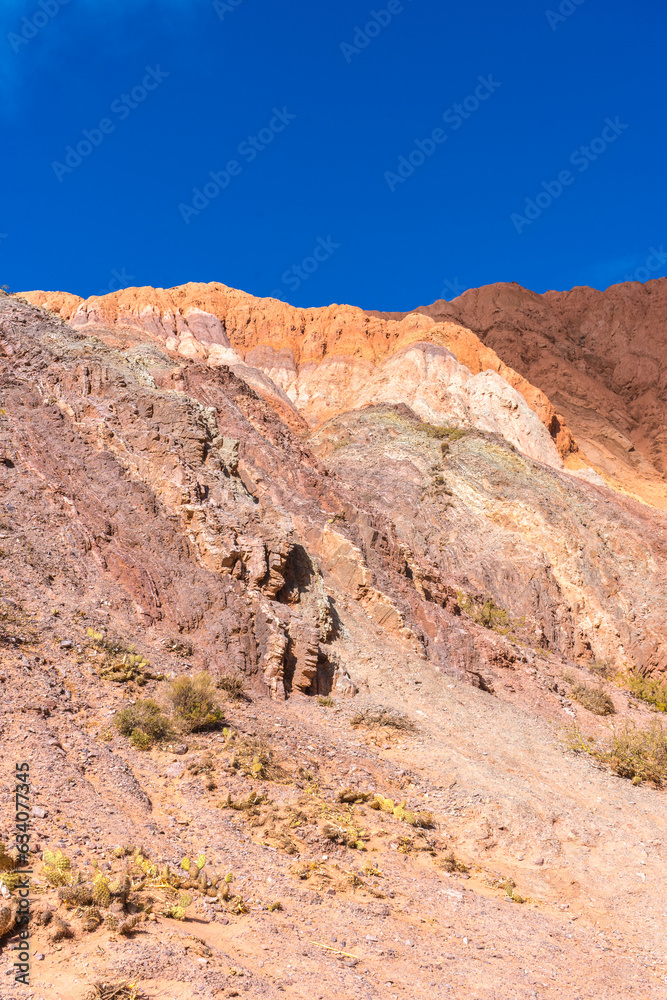 HILL OF SEVEN COLORS IN PURMAMARCA. HUMAHUACA, JUJUY. ARGENTINE NORTHWEST. FAMOUS TOURIST PLACE.