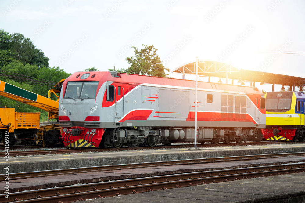 A train of diesel trains entering the platform Freight and passenger trains