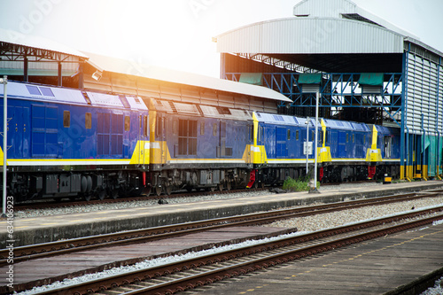 A train of diesel trains entering the platform Freight and passenger trains