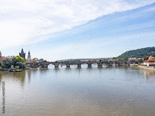 The multiple arches of the pedestrian bridge, Charles Bridge, span the Vltava River. Photo taken from Manes Bridge to the north.