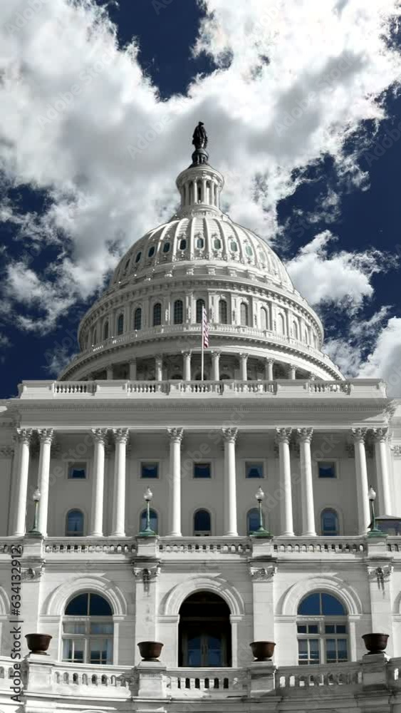 US Capitol building with time lapse clouds in Washington DC. Vertical view. US Capitol building with time lapse clouds in Washington DC. Vertical view.
