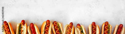 Schilderij op canvas Assortment of hot dogs with a variety of toppings