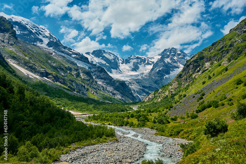 panorama of summer mountains with waterfalls