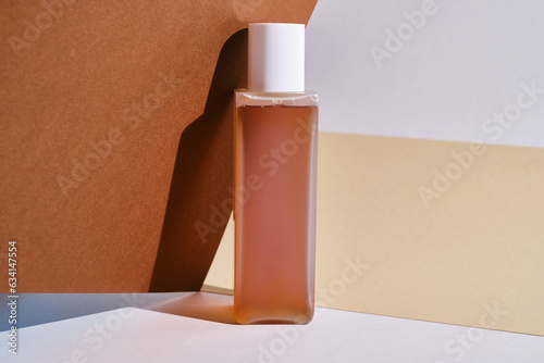 Container for cream, shampoo, toiletries, spa. Unbranded white and plastic bottles. Bottle with a dispenser for cosmetics. Skin care and beauty concept. Mockup style, copy space
