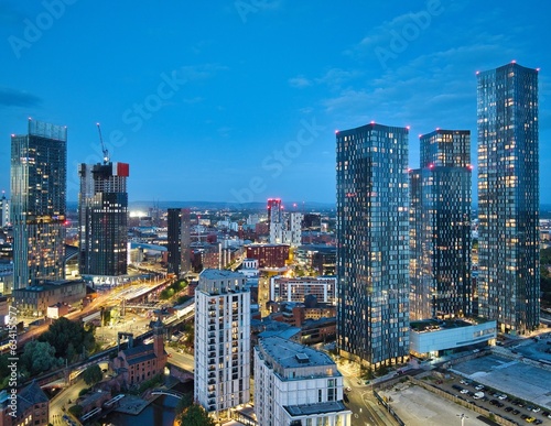 Aerial photo of Manchester skyscrapers and new development taken from Castlefield, showing the constant changing vibrant skyline during the blue hour.
