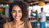 young adult woman, 20s 30s, caucasian multiracial, curly brunette hair, tank top, in summer in a restaurant on the terrace or cafe during leisure time or summer vacation, fictional location