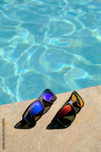 sunglasses on the background of the pool