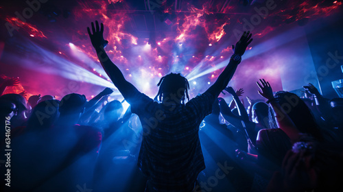 crowd of people dancing at concert