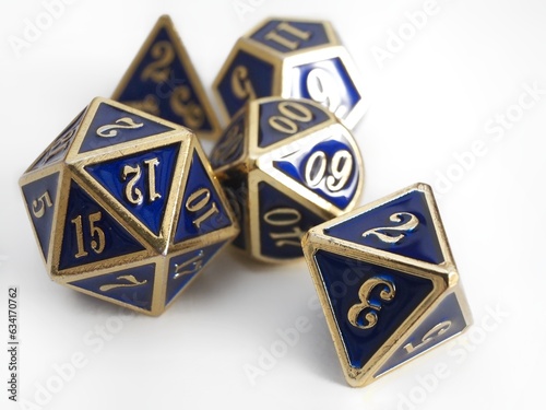 Some RPG DND blue and gold dice isolated on white 