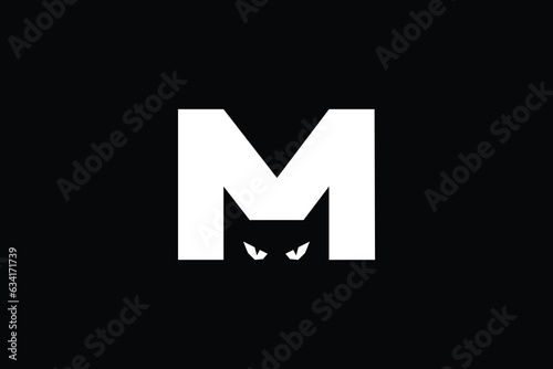 Black Cat Letter M logo design . creative Cat Logo in the Negative space of Letter M . clean and modern execution