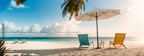 2 beach chairs on a beautiful tropical beach. Wide panorama background with white sand, coco palm trees, and an amazing beach landscape. Travel and tourism vibes captured