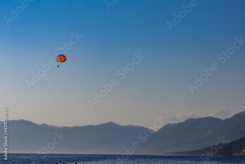 Parasailing on the Adriatic Sea in Makarska riviera with mountain view