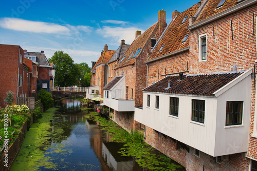 The so-called hanging kitchens of medieval buildings along a canal in the town of Appingedam, province of Groningen, the Netherlands 