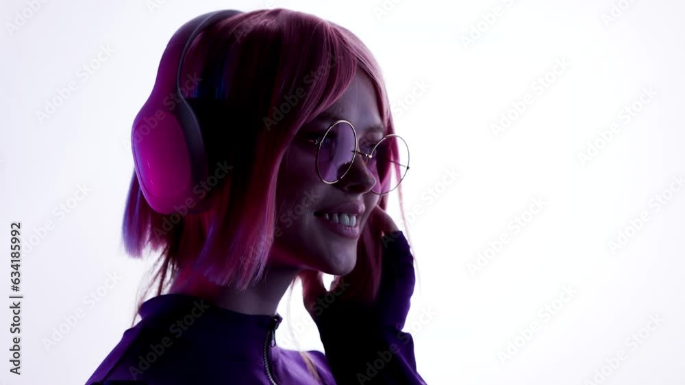 Hologram woman in futuristic costume with flowing hair. Female in modern VR glasses interacting with network while having virtual reality experience. Augmented reality game, future technology, AI. Hologram woman in futuristic costume with flowing hair. Female in modern VR glasses interacting with network while having virtual reality experience. Augmented reality game, future technology, AI.
