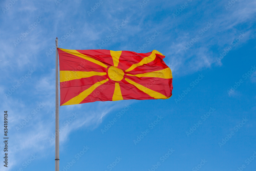 North Macedonian flag waving atop of its pole North Macedonian flag waving atop of its pole