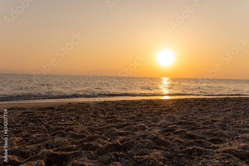 a sunset on the sea beach © vovan