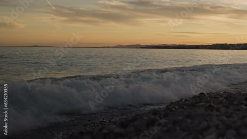Wallpaper Mural Low angle shot of sunset on a pebble beach of Nice Torontodigital.ca