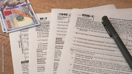 tax forms with pen on a table photo