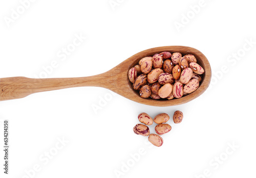 Wooden spoon and dry kidney beans isolated on white, top view