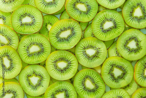 macro kiwi,Fresh Kiwi fruit sliced use for background,slice of kiwi fruit on a full frame. horizontal format