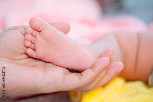 baby feet,Parents hold newborn baby in hands and feet
