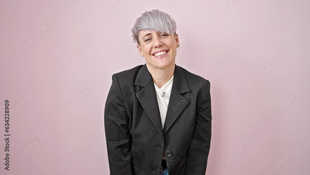 Young woman business worker blowing kiss smiling over isolated pink background Young woman business worker blowing kiss smiling over isolated pink background